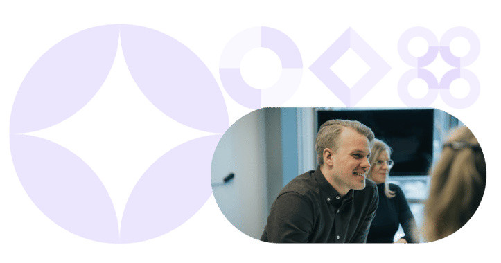 Team collaborating on enterprise automation strategies, featuring a smiling professional in a modern workspace with geometric design elements.